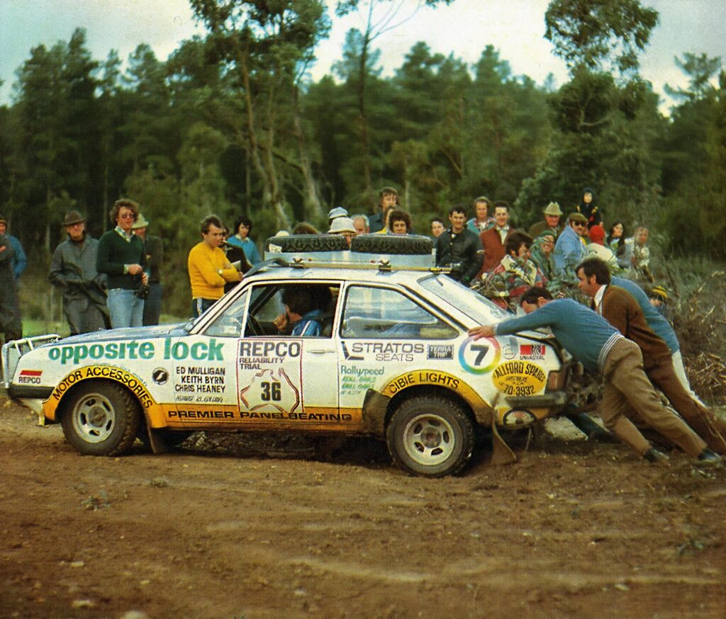 Spectators at Kuipto special stage' assist the Mulligan/ Byrne/ Heaney Escort after it stalled and broke the starter motor.